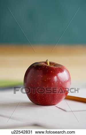 Red apple on teacher's desk View Large Photo Image Stock Image - Red apple on teacher's desk. Fotosearch
