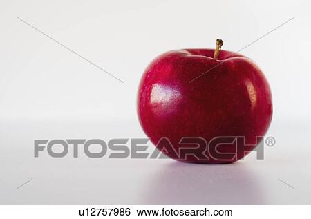 Stock Photograph - Red apple on white background. Fotosearch