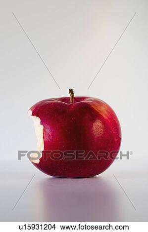 Red apple with missing bite, studio shot View Large Photo Image Picture - Red apple with missing bite, studio shot. Fotosearch