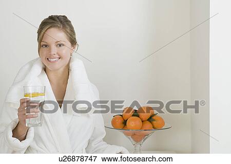 Relaxed woman drinking water View Large Photo Image Stock Photo - Relaxed woman drinking water. Fotosearch