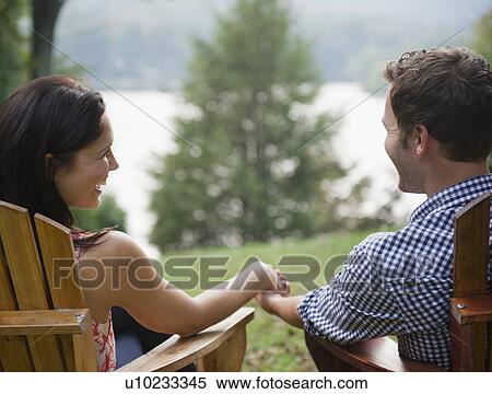 Roaring Brook Lake, Close up of couple relaxing by lake View Large Photo Image Stock Photography - Roaring Brook Lake, Close up of couple relaxing by lake. Fotosearch