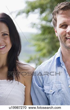 Stock Image - Roaring Brook Lake, Close up of happy couple. Fotosearch