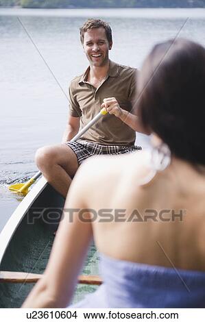 Roaring Brook Lake, Couple in boat on lake View Large Photo Image Picture - Roaring Brook Lake, Couple in boat on lake. Fotosearch