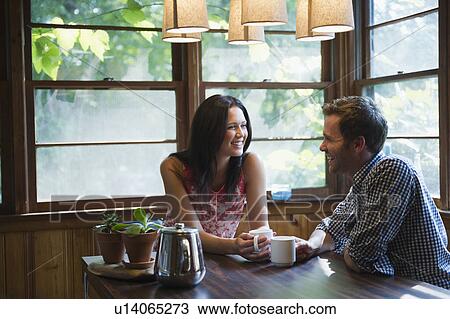Roaring Brook Lake, Couple sitting at table View Large Photo Image Stock Image - Roaring Brook Lake, Couple sitting at table. Fotosearch