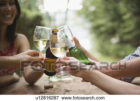 Stock Photo - Roaring Brook Lake, Friends making toast. Fotosearch