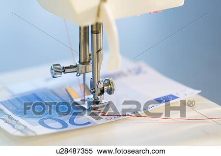 Sewing machine stitching 20 euro note, studio shot View Large Photo Image Stock Photography - Sewing machine stitching 20 euro note, studio shot. Fotosearch