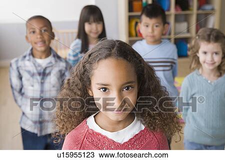 Smiling children (6-7) in classroom View Large Photo Image Stock Image - Smiling children (6-7) in classroom. Fotosearch
