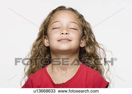 Smiling girl (8-9) with eyes closed, studio shot View Large Photo Image Stock Image - Smiling girl (8-9) with eyes closed, studio shot. Fotosearch