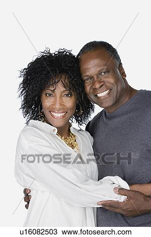 Studio portrait of mature couple View Large Photo Image Stock Image - Studio portrait of mature couple. Fotosearch