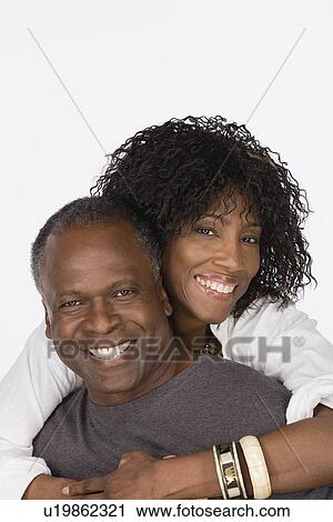 Studio portrait of mature couple View Large Photo Image Stock Image - Studio portrait of mature couple. Fotosearch