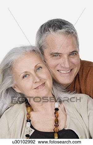 Studio portrait of mature couple View Large Photo Image Stock Image - Studio portrait of mature couple. Fotosearch
