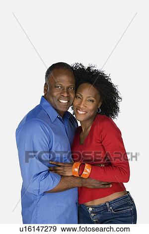 Stock Photo - Studio portrait of mature couple. Fotosearch