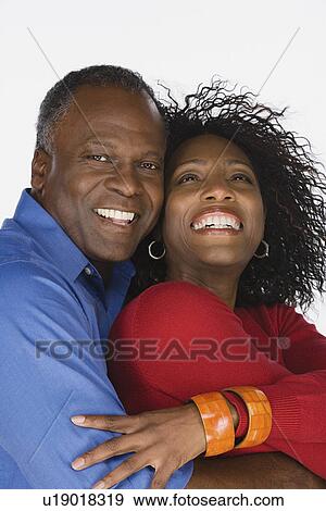 Stock Photo - Studio portrait of mature couple. Fotosearch