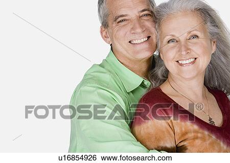 Stock Photograph - Studio portrait of mature couple. Fotosearch