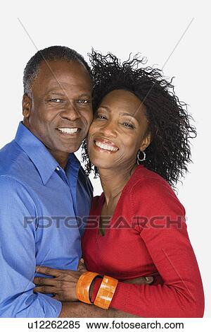 Stock Photography - Studio portrait of mature couple. Fotosearch