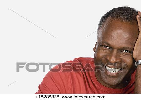 Stock Photo - Studio portrait of mature man. Fotosearch