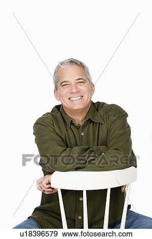 Stock Photo - Studio portrait of mature man. Fotosearch