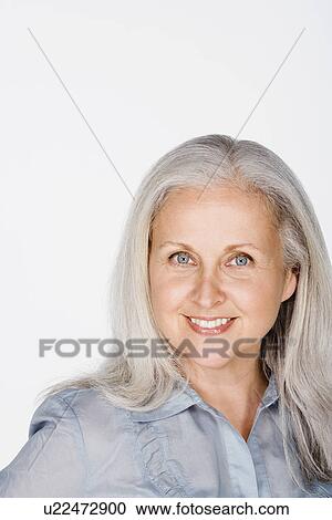 Stock Image - Studio portrait of mature woman. Fotosearch