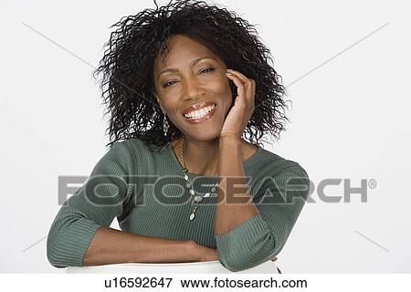 Stock Photo - Studio portrait of mature woman. Fotosearch