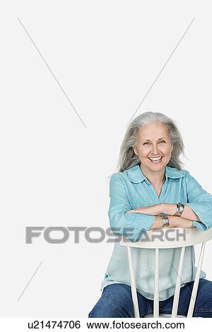 Stock Photograph - Studio portrait of mature woman. Fotosearch