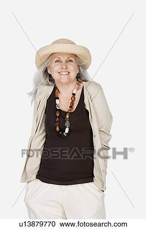 Studio portrait of mature woman wearing hat View Large Photo Image Stock Image - Studio portrait of mature woman wearing hat. Fotosearch