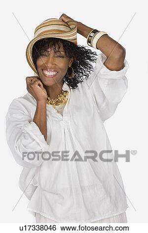 Studio portrait of mature woman wearing hat View Large Photo Image Stock Photograph - Studio portrait of mature woman wearing hat. Fotosearch