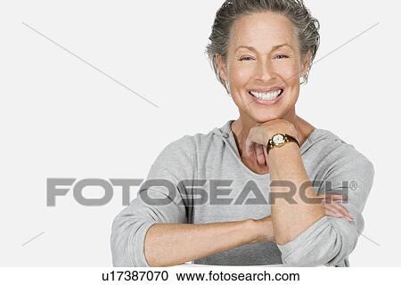 Stock Image - Studio portrait of senior woman. Fotosearch
