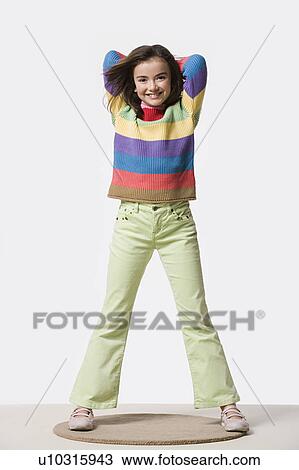 Studio portrait of smiling girl (8-9) View Large Photo Image Stock Image - Studio portrait of smiling girl (8-9). Fotosearch