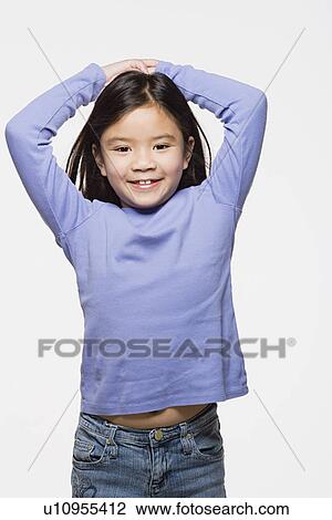Studio portrait of smiling girl (8-9) View Large Photo Image Stock Image - Studio portrait of smiling girl (8-9). Fotosearch