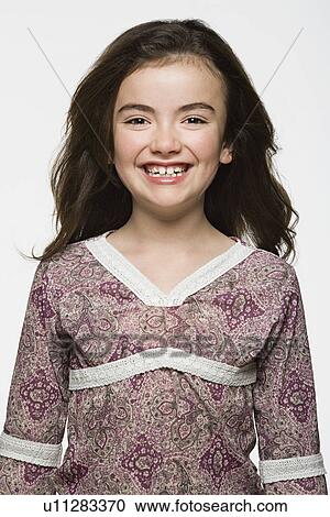 Studio portrait of smiling girl (8-9) View Large Photo Image Stock Image - Studio portrait of smiling girl (8-9). Fotosearch
