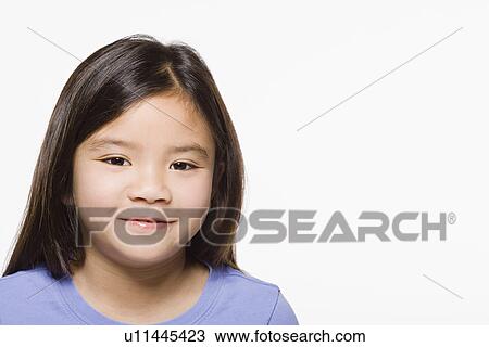 Studio portrait of smiling girl (8-9), close up View Large Photo Image Stock Image - Studio portrait of smiling girl (8-9), close up. Fotosearch