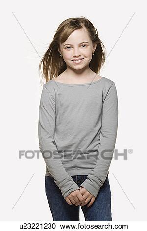 Studio portrait of smiling girl (8-9) View Large Photo Image Stock Image - Studio portrait of smiling girl (8-9) . Fotosearch