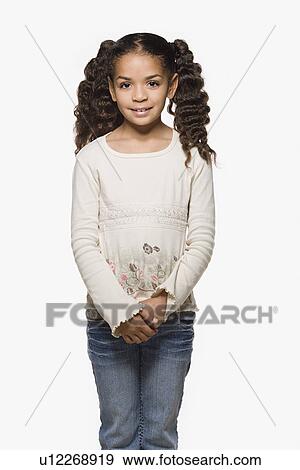 Studio portrait of smiling girl (8-9) with pigtails View Large Photo Image Stock Photo - Studio portrait of smiling girl (8-9) with pigtails. Fotosearch