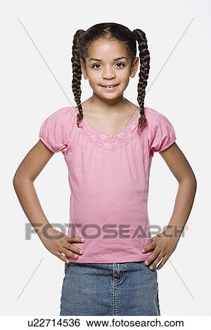 Studio portrait of smiling girl (8-9) with plaits View Large Photo Image Stock Photograph - Studio portrait of smiling girl (8-9) with plaits. Fotosearch