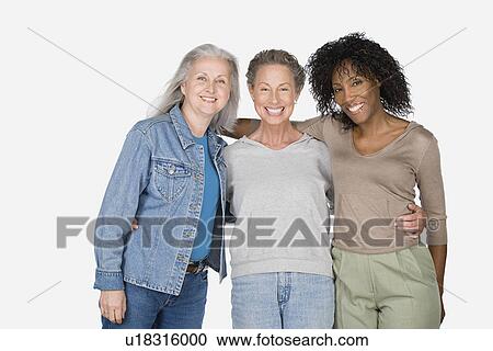Studio portrait of three mature women View Large Photo Image Stock Image - Studio portrait of three mature women. Fotosearch