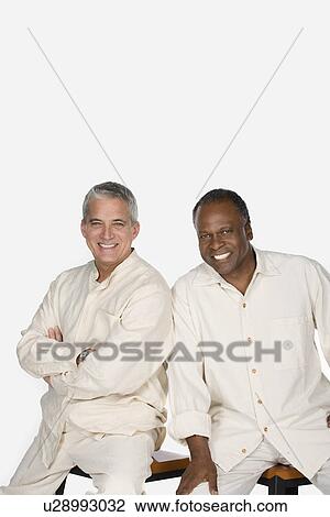Studio portrait of two mature men View Large Photo Image Stock Image - Studio portrait of two mature men. Fotosearch