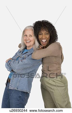 Picture - Studio portrait of two mature women. Fotosearch