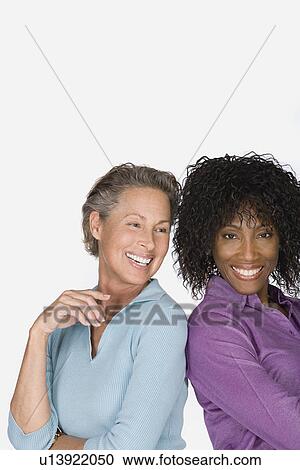 Studio portrait of two mature women View Large Photo Image Stock Image - Studio portrait of two mature women. Fotosearch