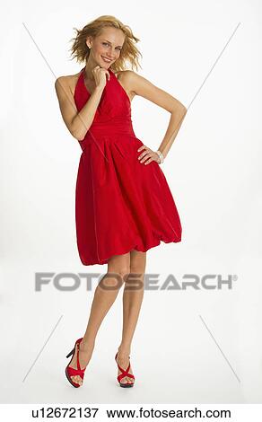 Studio portrait of woman in red dress View Large Photo Image Stock Photo - Studio portrait of woman in red dress. Fotosearch