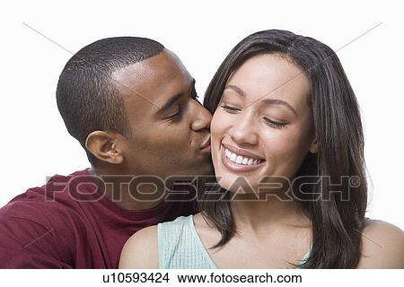Picture - Studio portrait of young couple. Fotosearch