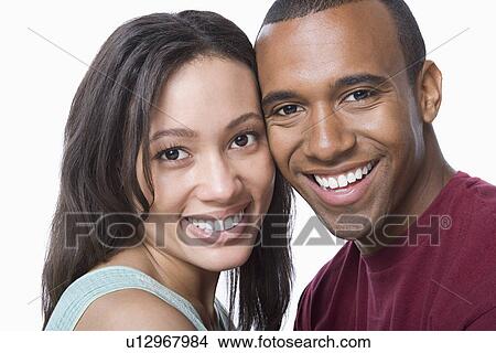 Picture - Studio portrait of young couple. Fotosearch