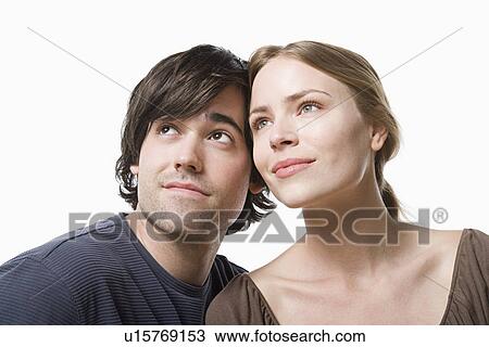 Studio portrait of young couple View Large Photo Image Stock Image - Studio portrait of young couple. Fotosearch