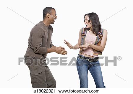 Studio portrait of young couple View Large Photo Image Stock Image - Studio portrait of young couple. Fotosearch