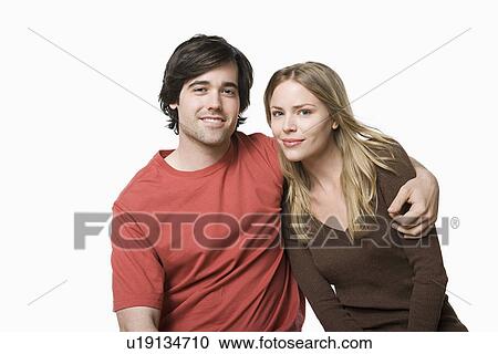 Studio portrait of young couple View Large Photo Image Stock Image - Studio portrait of young couple. Fotosearch