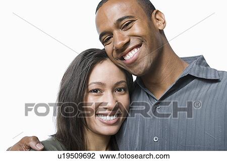 Studio portrait of young couple View Large Photo Image Stock Image - Studio portrait of young couple. Fotosearch