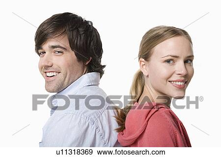 Studio portrait of young couple View Large Photo Image Stock Photo - Studio portrait of young couple. Fotosearch