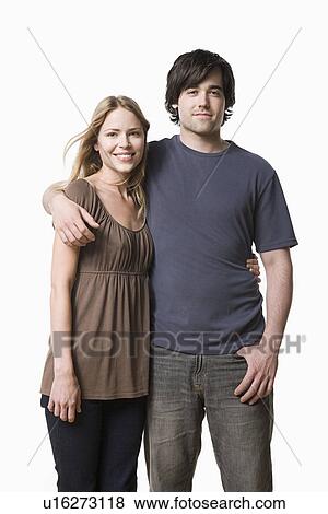 Studio portrait of young couple View Large Photo Image Stock Photo - Studio portrait of young couple. Fotosearch