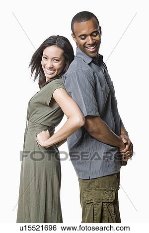 Studio portrait of young couple View Large Photo Image Stock Photograph - Studio portrait of young couple. Fotosearch