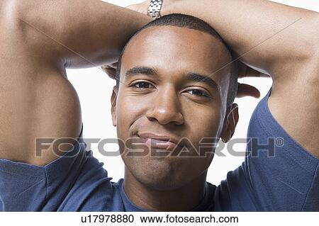 Studio portrait of young man View Large Photo Image Stock Image - Studio portrait of young man. Fotosearch