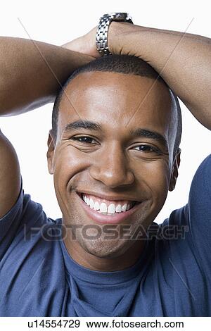 Stock Photo - Studio portrait of young man. Fotosearch